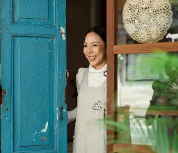 Opening the blue door at a restaurant