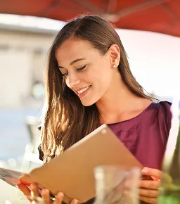 Woman using a tablet for digital ordering