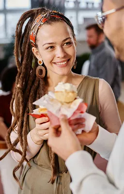 Smiling woman holding a plate of food